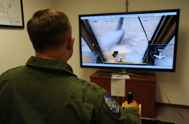 US Air Force General Gorenc Operates Aircraft Deicing Simulator